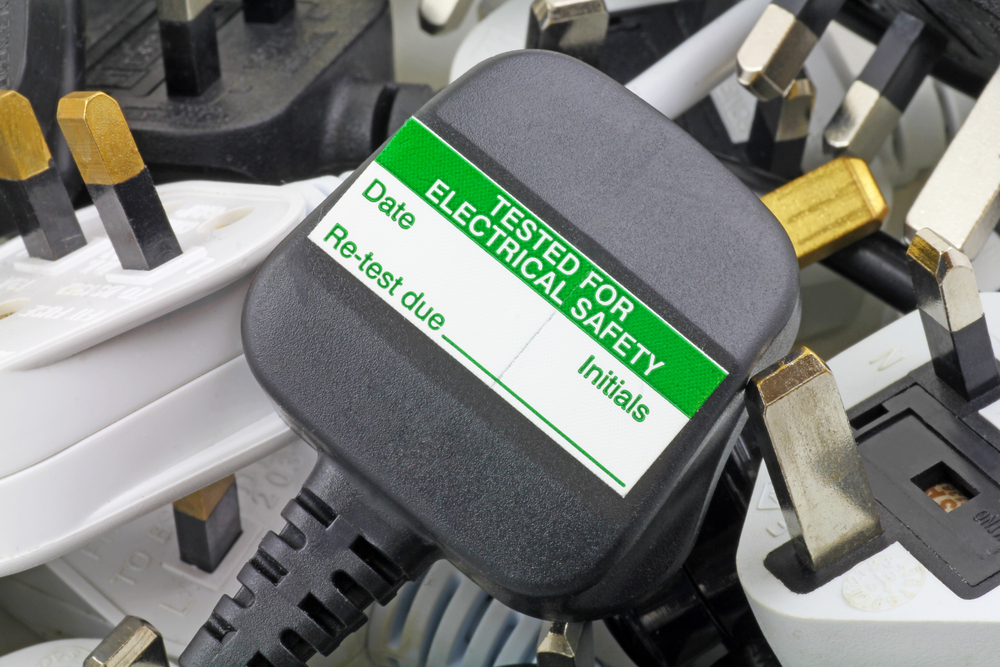 A plug with a PAT testing sticker