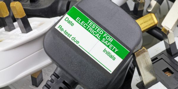 A plug with a PAT testing sticker
